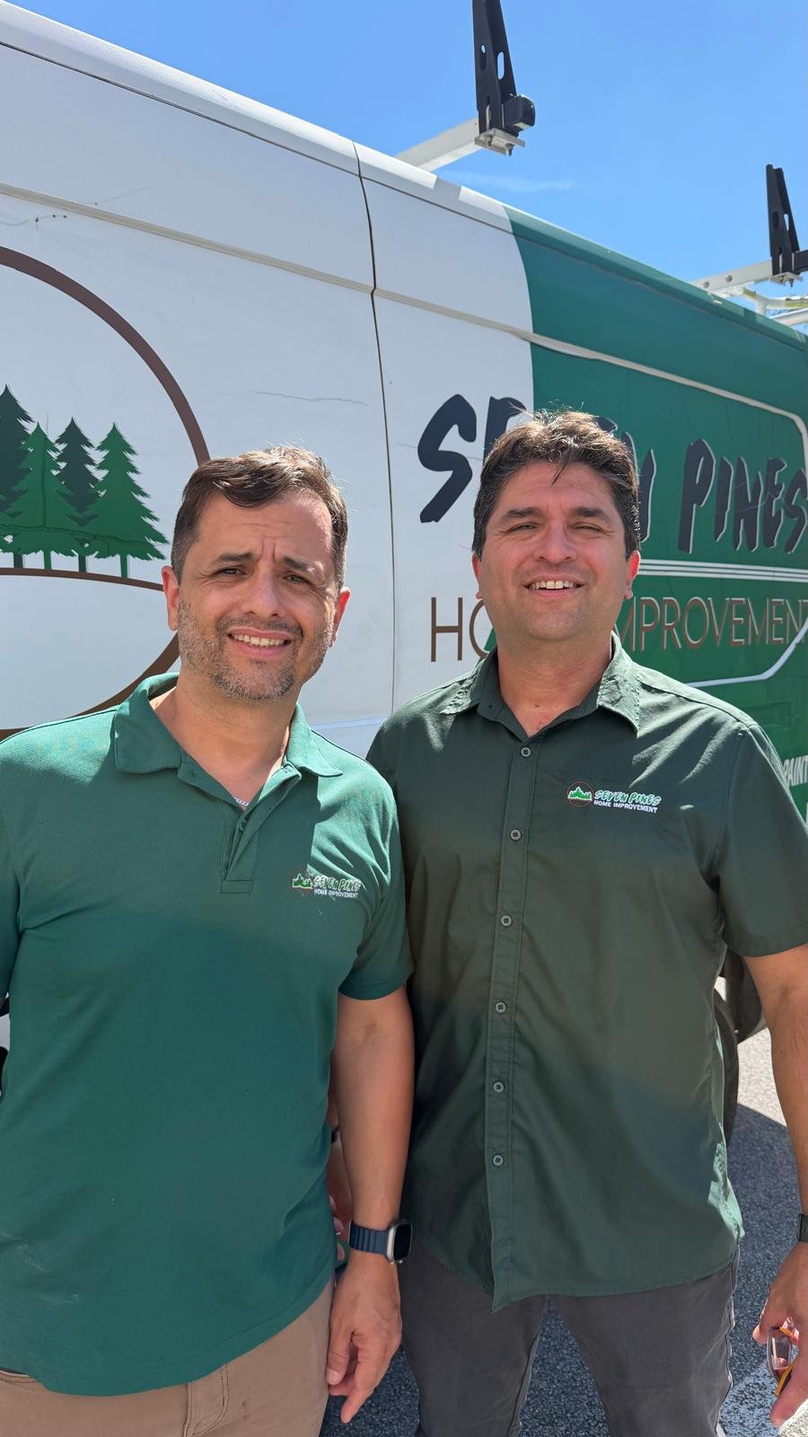 Marcony and Romero Araujo, the owners of Seven Pines Home Improvement, in front of a company van