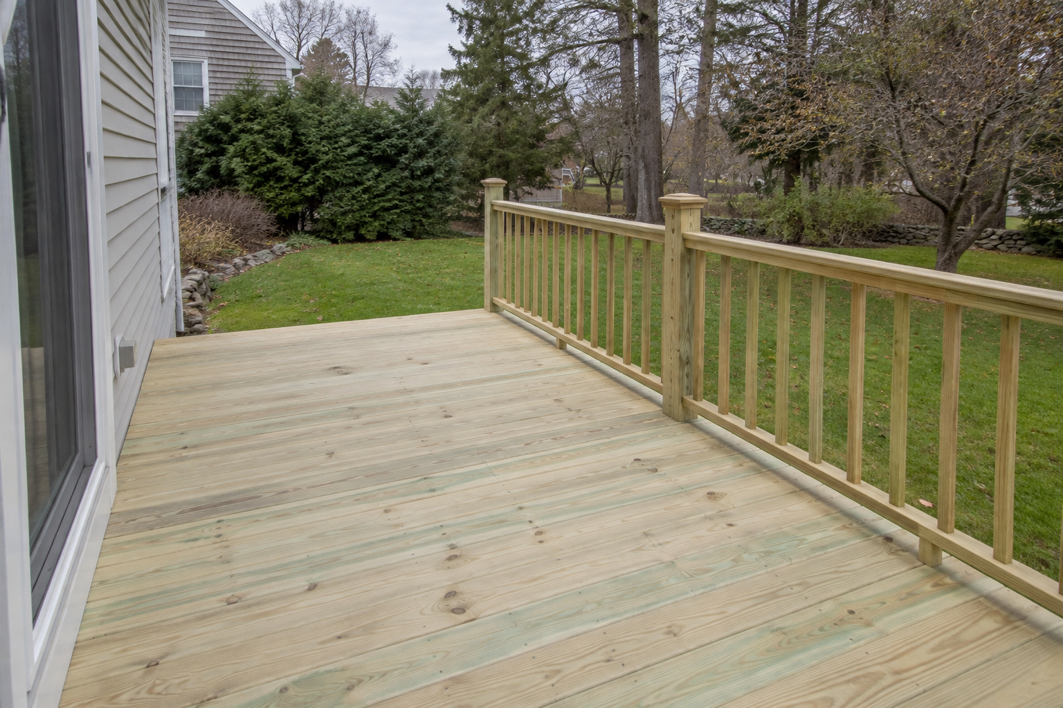 Pressure treated deck boards and framing on a residential back deck